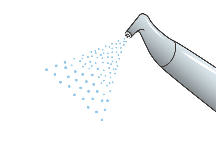 専用パウダーをジェット水流で歯に吹き付けているエアフローのイメージイラスト